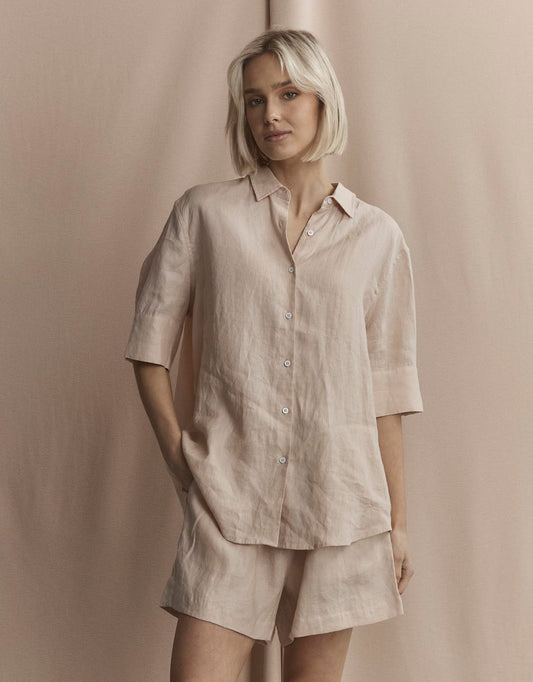 Image of a model wearing Tops. Productname: Nora Linen Shirt - in Sand colour by brand - White by FTL