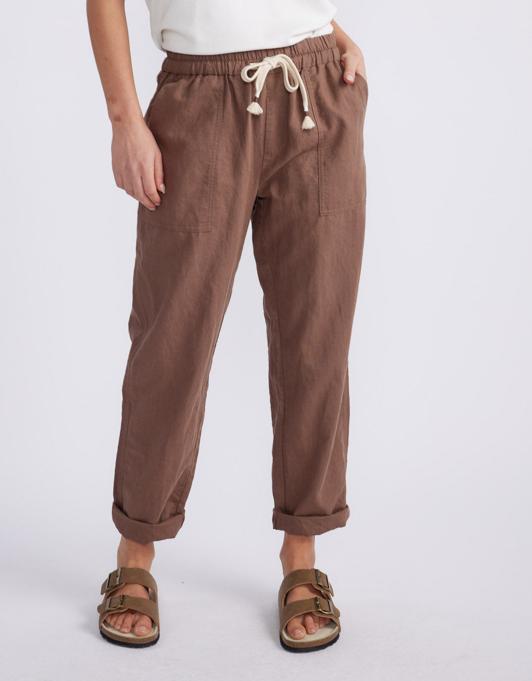 Image of a model wearing Pants. Product name - Linen Beach Comber Pant Chocolate in Chocolate colour by brand - White & Co.