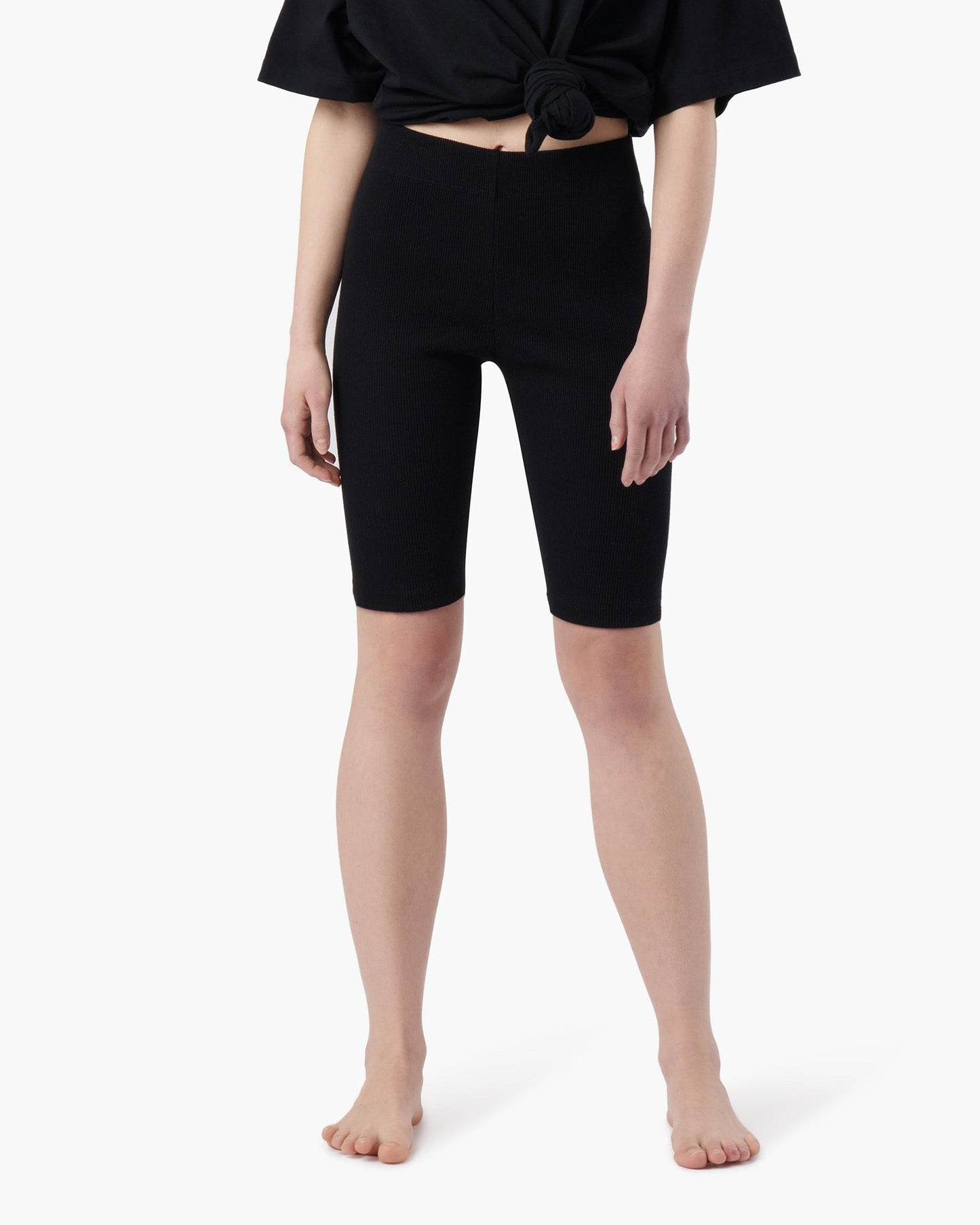 Image of a model wearing Shorts. Productname: Biker Short Black in Black colour by brand - TKEES