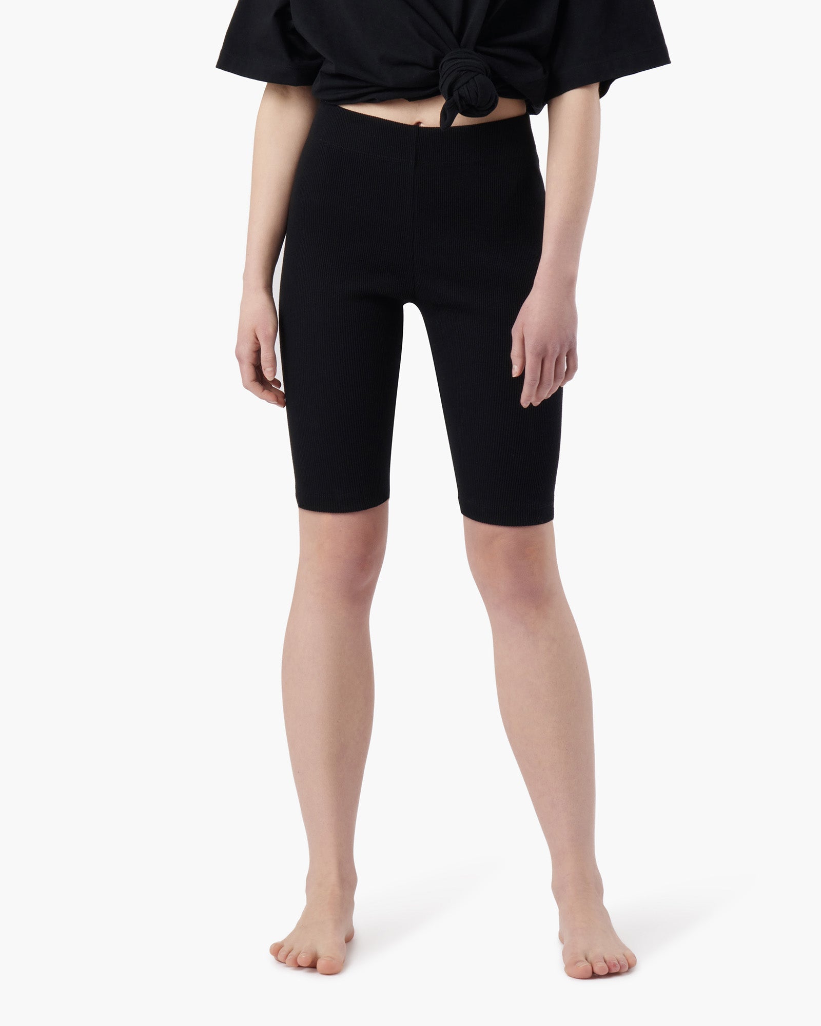 Image of a model wearing Shorts. Productname: Biker Short Black in Black colour by brand - TKEES