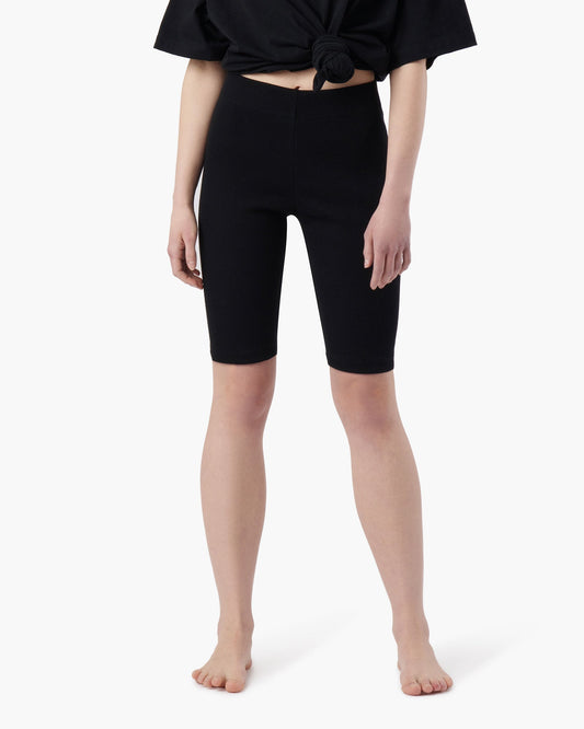 Image of a model wearing Shorts. Productname: Biker Short Black in Black colour by brand - TKEES