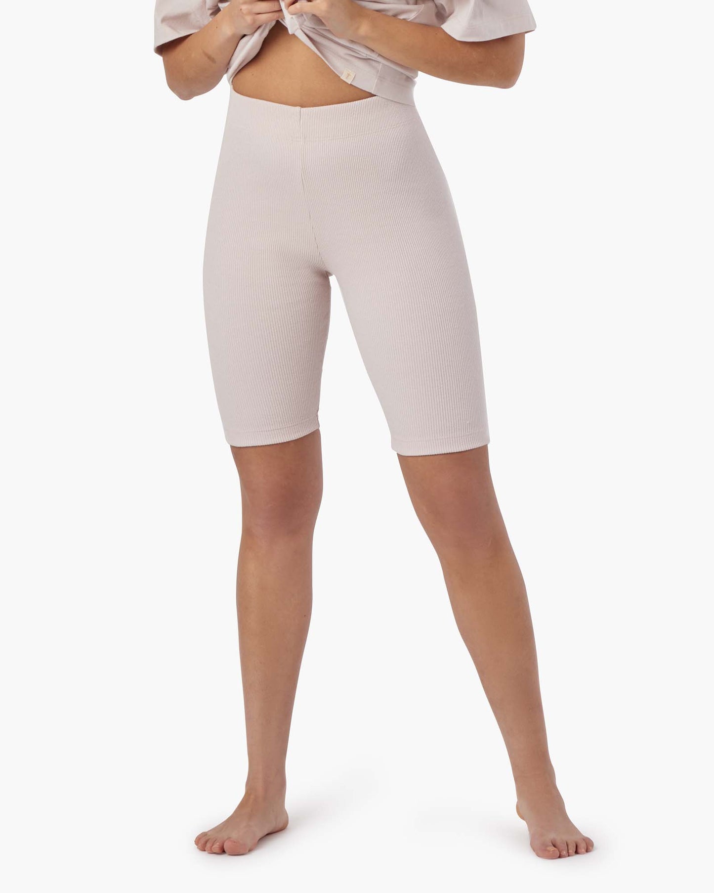 Image of a model wearing Shorts. Productname: Biker Short Cloudy Rose in Cloudy Rose colour by brand - TKEES