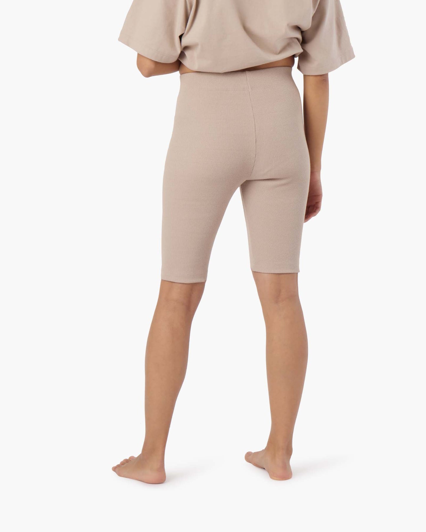 Image of a model wearing Shorts. Productname: Biker Short Sandy Taupe in Sandy Taupe colour by brand - TKEES