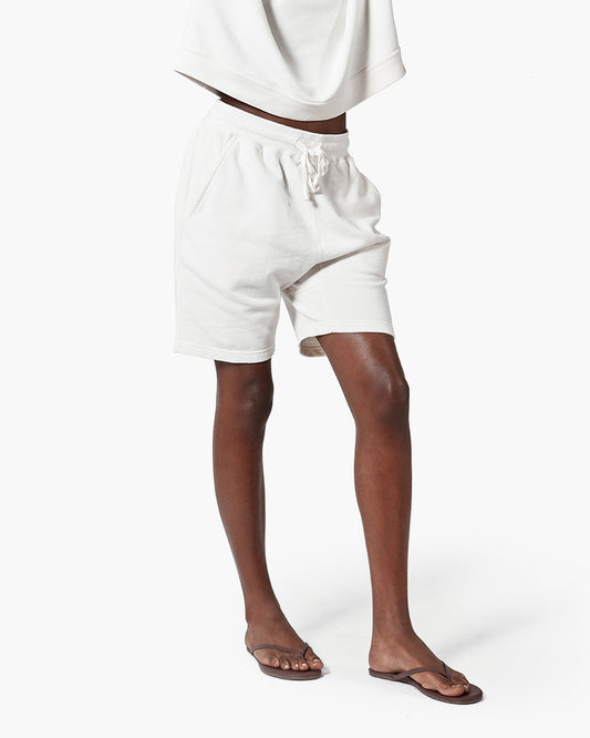 Image of a model wearing Shorts. Productname: Core Short Cream in Cream colour by brand - TKEES