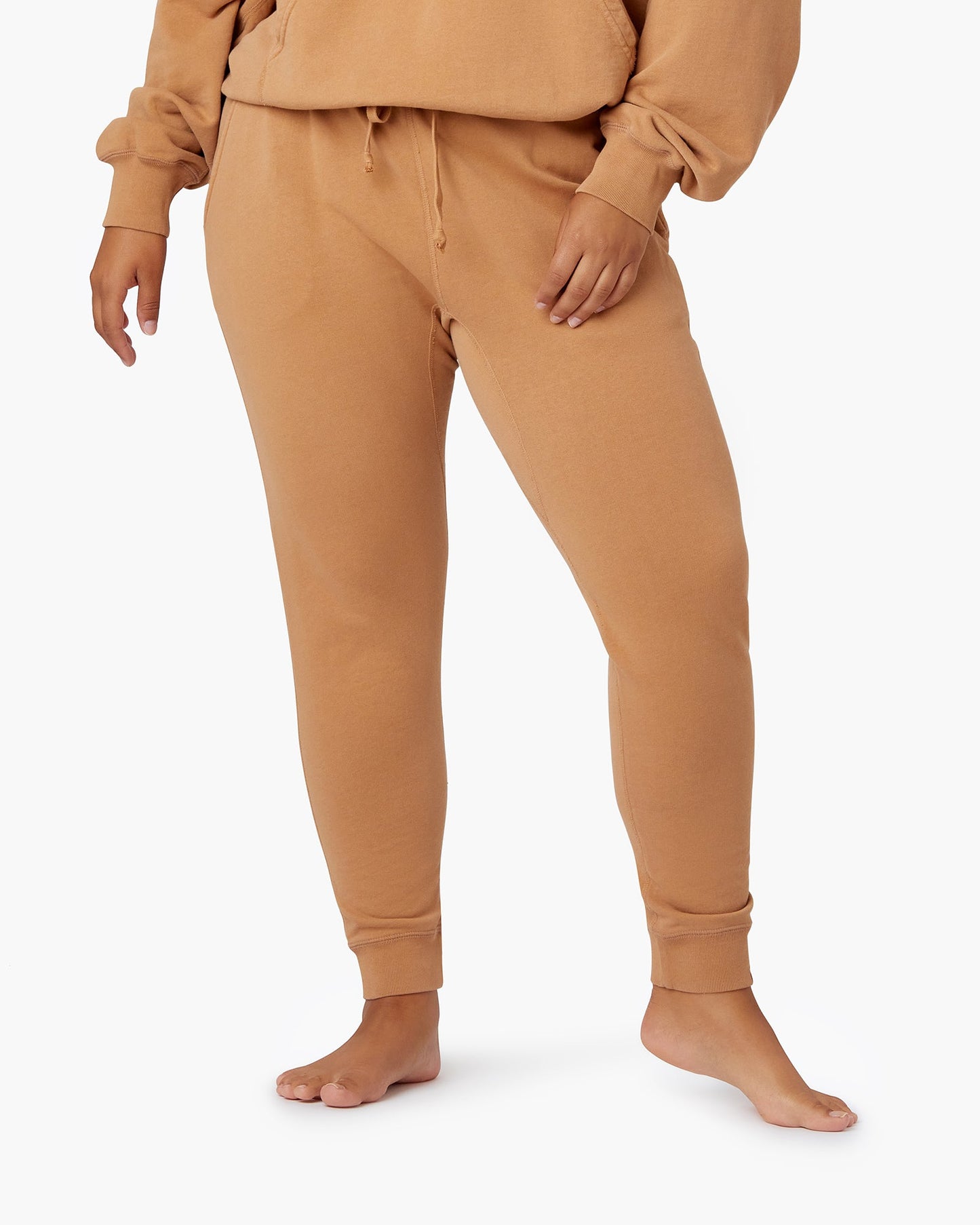 Image of a model wearing Pants. Productname: Core Sport Jogger Toast in Toast colour by brand - TKEES