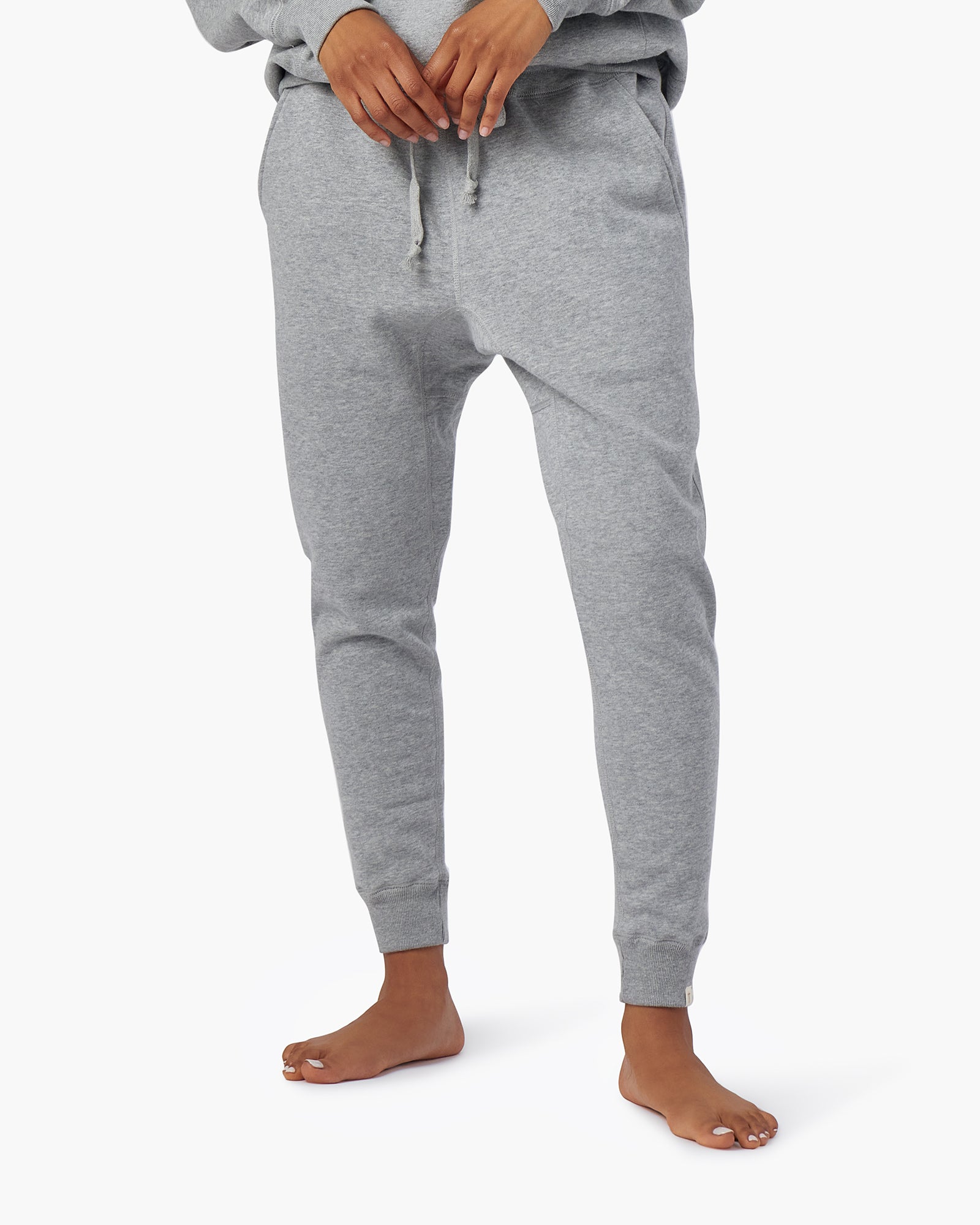 Image of a model wearing Outerwear. Productname: Core Fleece Sport Jogger Grey Mix in Grey Mix colour by brand - TKEES