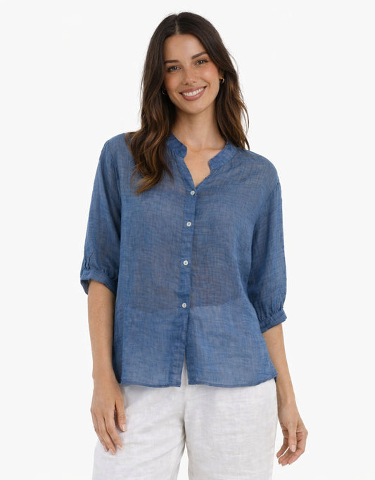 Image of a model wearing Tops. Productname: Allegra Linen Shirt - in Denim colour by brand - Worthier The Label