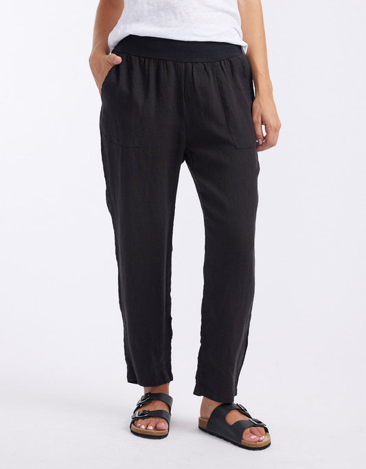 Image of a model wearing Pants. Productname: Sorrento Linen Pants - in Black colour by brand - Worthier The Label