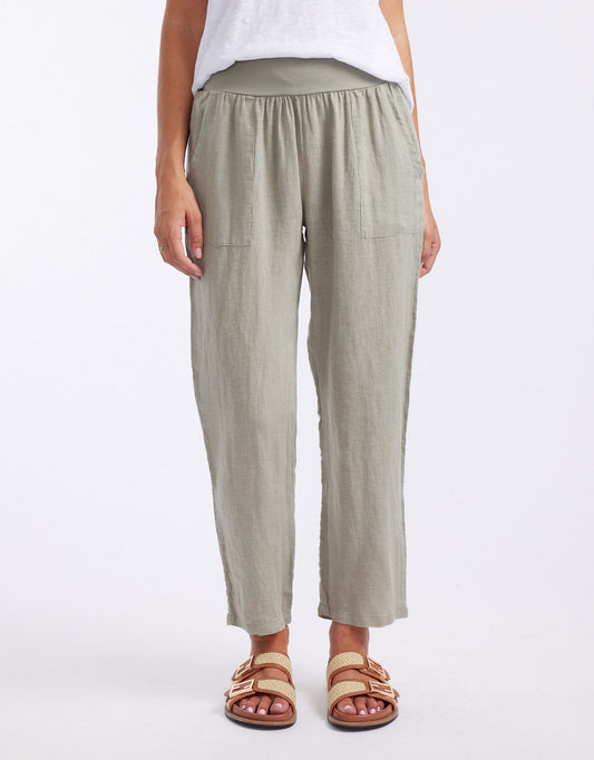 Image of a model wearing Pants. Productname: Sorrento Linen Pants - in Khaki colour by brand - Worthier The Label